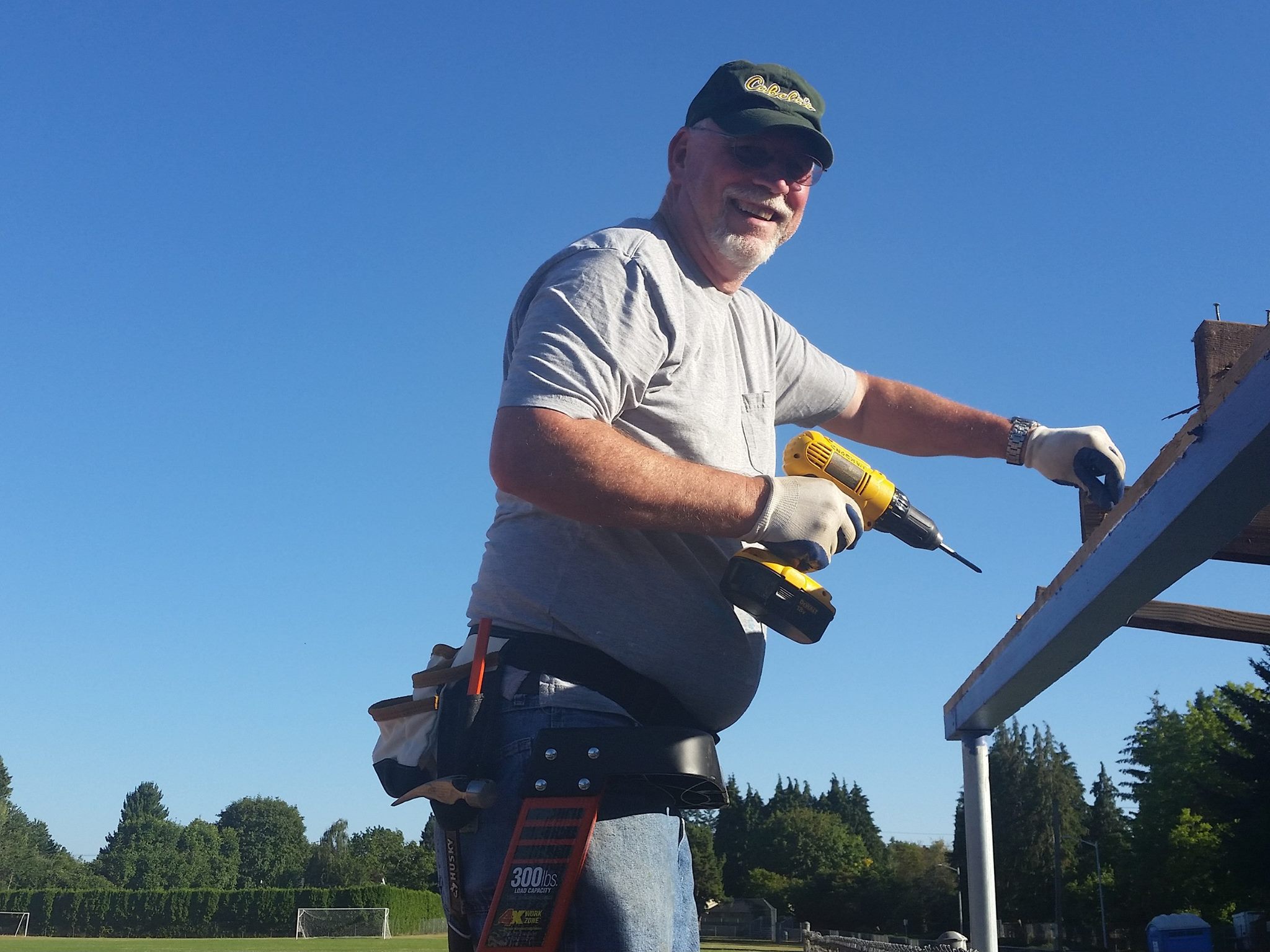 Guy with gloves and screw driver working